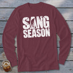 Maroon long-sleeve t-shirt with distressed white text reading SANG SEASON and a silhouette of someone digging.