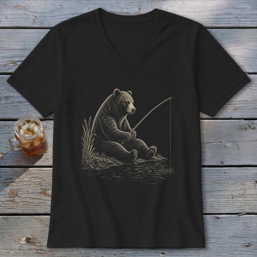 Black t-shirt with a drawing of a bear fishing by the water.