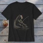 Black t-shirt with a drawing of a bear fishing by the water.