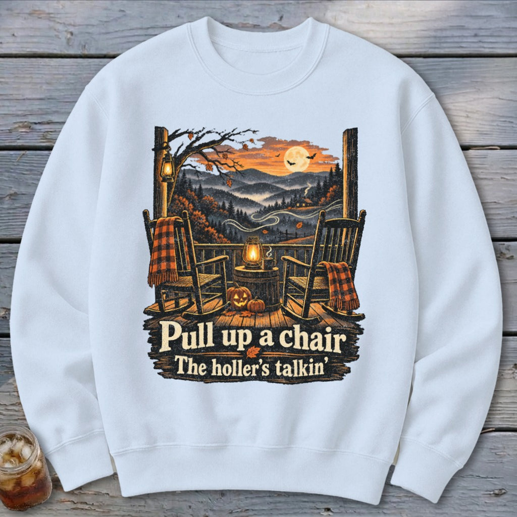 Sweatshirt with two rocking chairs on a porch, autumn landscape, and text "Pull up a chair The holler's talkin'".