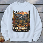 Sweatshirt with two rocking chairs on a porch, autumn landscape, and text "Pull up a chair The holler's talkin'".