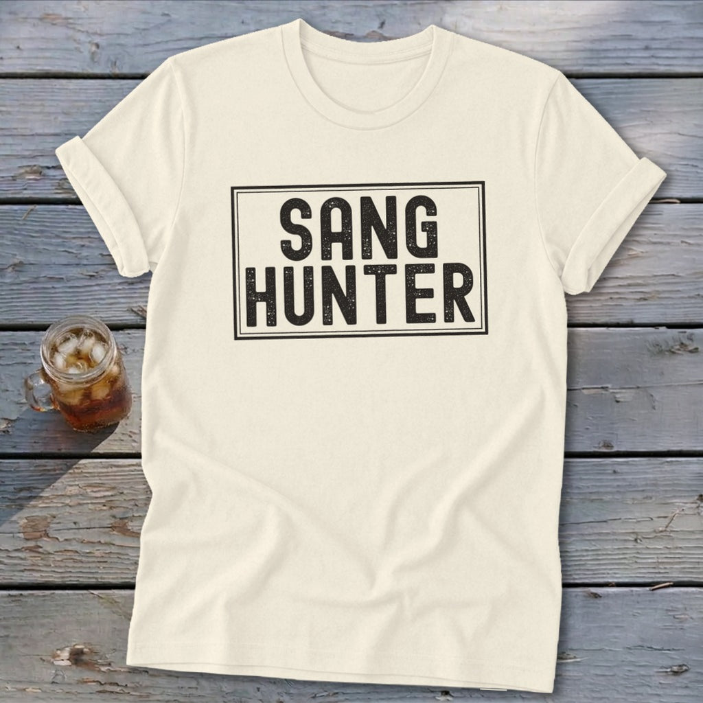 Cream t-shirt with black text that reads "SANG HUNTER" in a rectangular box.
