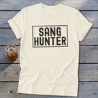 Cream t-shirt with black text that reads "SANG HUNTER" in a rectangular box.