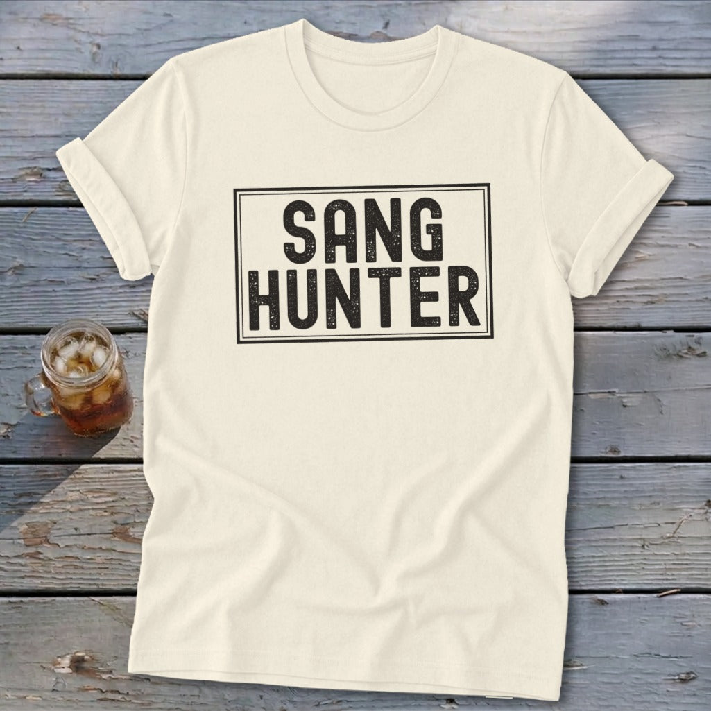 Cream t-shirt with black text that reads "SANG HUNTER" in a rectangular box.