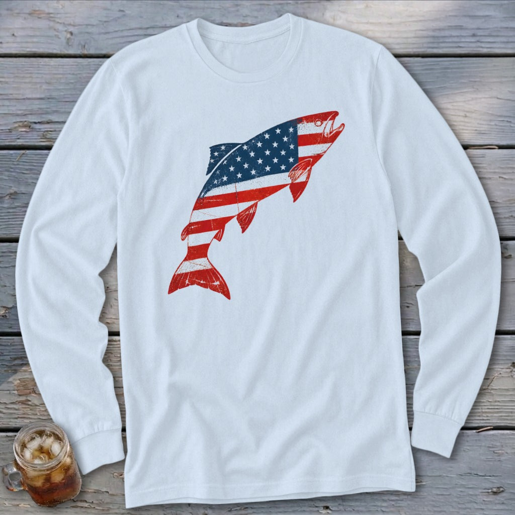 White long-sleeve t-shirt featuring a distressed graphic of a jumping fish patterned with the American flag.