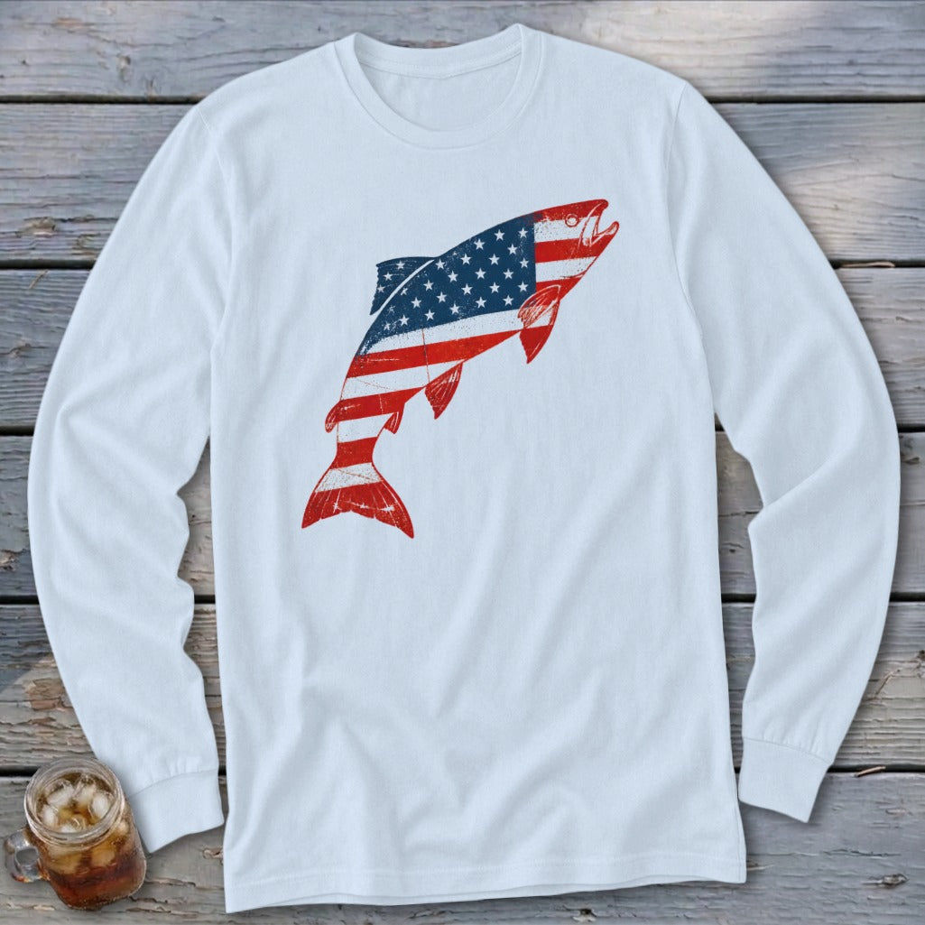 White long-sleeve t-shirt featuring a distressed graphic of a jumping fish patterned with the American flag.
