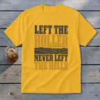 Yellow t-shirt with text "LEFT THE HOLLER NEVER LEFT THE HILLS" and mountain graphic.