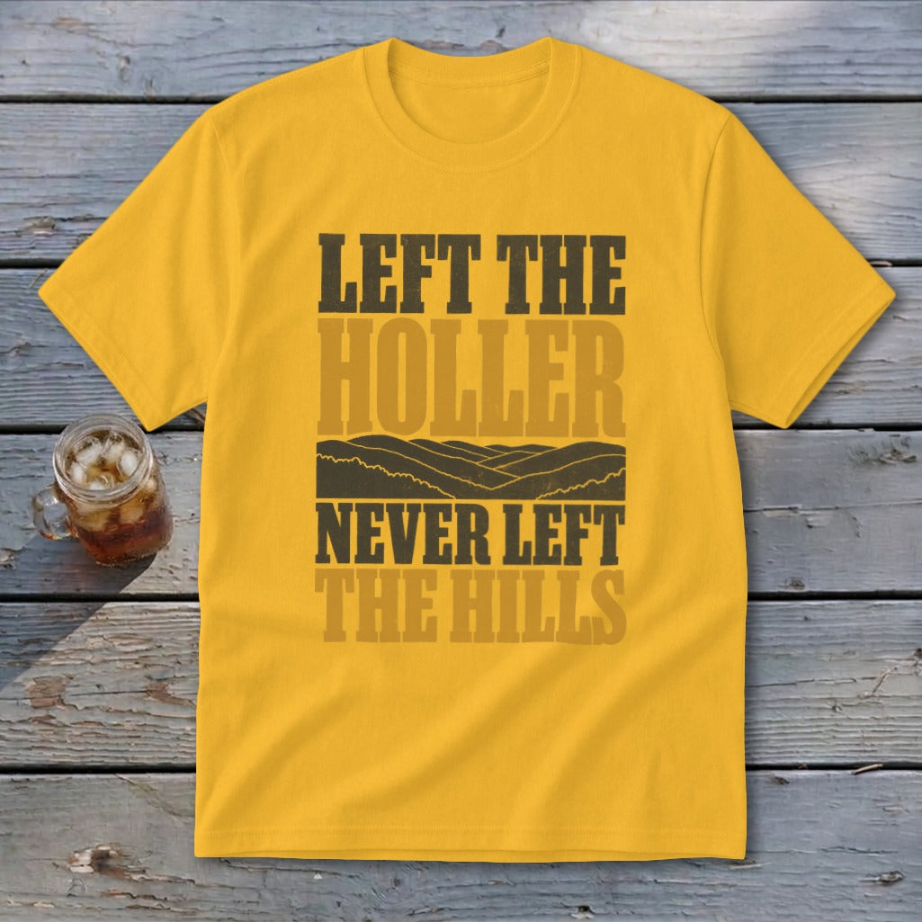 Yellow t-shirt with text "LEFT THE HOLLER NEVER LEFT THE HILLS" and mountain graphic.