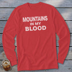 Red long-sleeve shirt with white text "MOUNTAINS IN MY BLOOD"