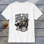 White V-neck t-shirt featuring a graphic of a bear relaxing in a rocking chair with text.