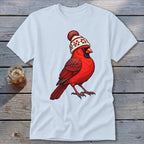 A light blue t-shirt printed with a graphic of a red cardinal wearing a winter beanie.