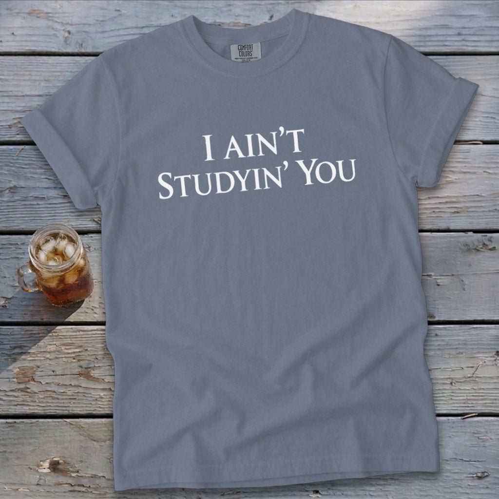 Grey Comfort Colors t-shirt with white text "I AIN'T STUDYIN' YOU".