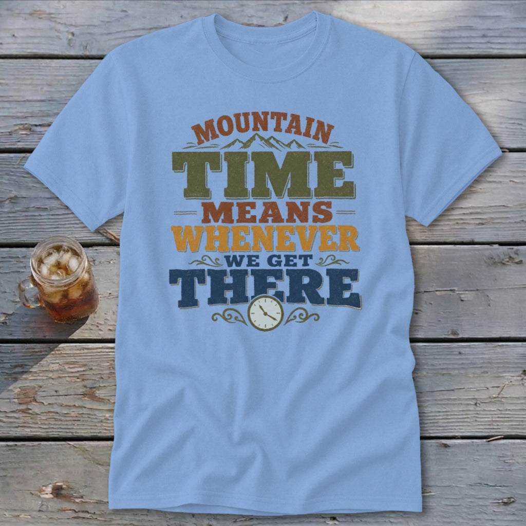 Light blue t-shirt with "MOUNTAIN TIME MEANS WHENEVER WE GET THERE" text and clock graphic.