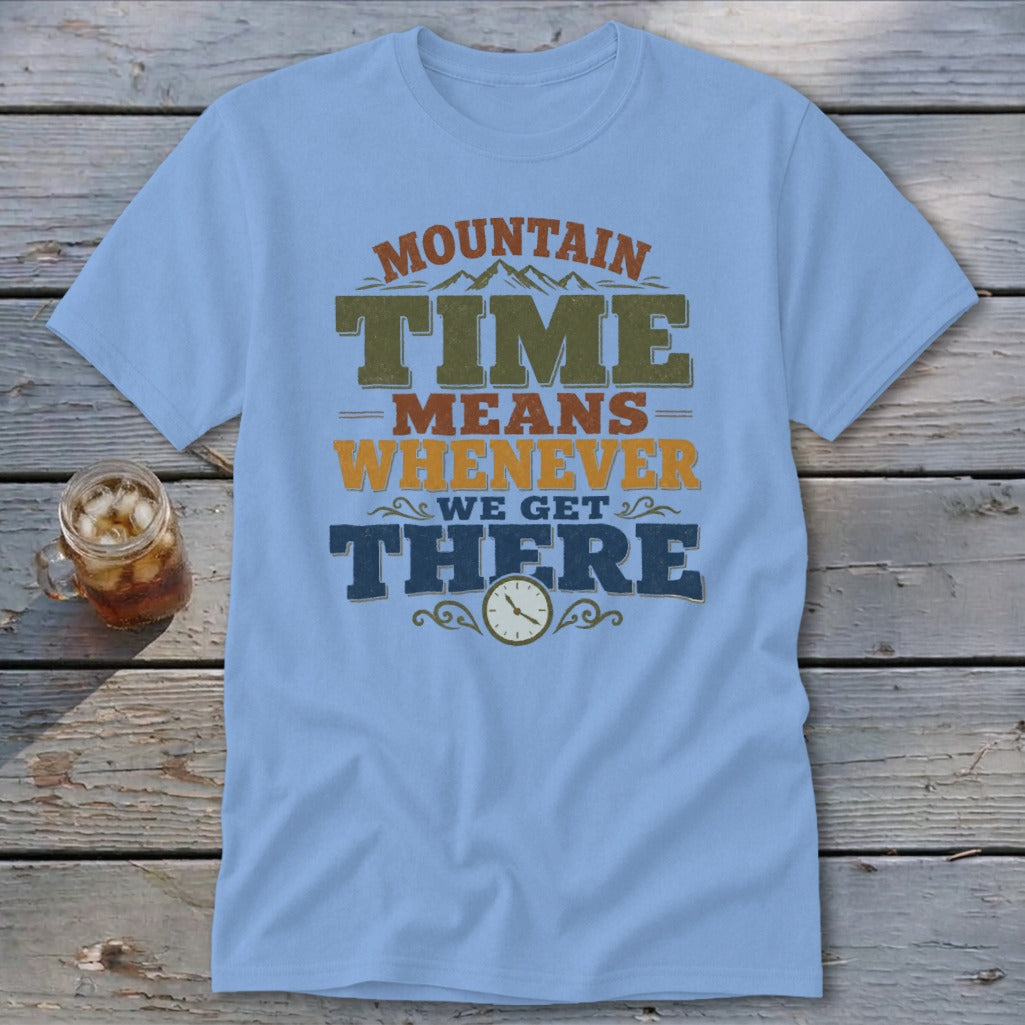 Light blue t-shirt with "MOUNTAIN TIME MEANS WHENEVER WE GET THERE" text and clock graphic.