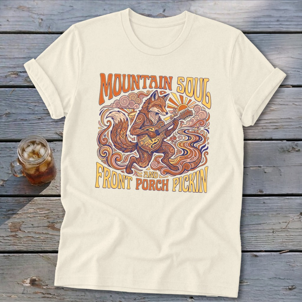 Cream t-shirt with "Mountain Soul" and "Front Porch Pickin'" text and a fox playing a guitar.