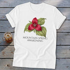White t-shirt with red trillium flower and text "MOUNTAIN SPRING AWAKENING".