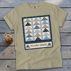 T-shirt with a blue and gray flying geese quilt graphic and text.
