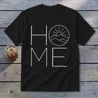 Black t-shirt featuring a white graphic with the word HOME, where the letter O is replaced by a sun setting over mountains.
