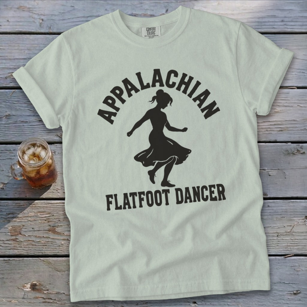 Light green crewneck t-shirt featuring a black silhouette of a dancer and the text Appalachian Flatfoot Dancer.