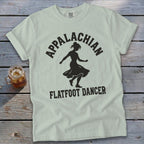 Light green crewneck t-shirt featuring a black silhouette of a dancer and the text Appalachian Flatfoot Dancer.