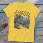 Yellow t-shirt with "No place sounds like home" text, bird, and mountain landscape graphic.