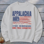 White crewneck sweatshirt with a distressed graphic of an American flag, Appalachia text, and patriotic slogan.