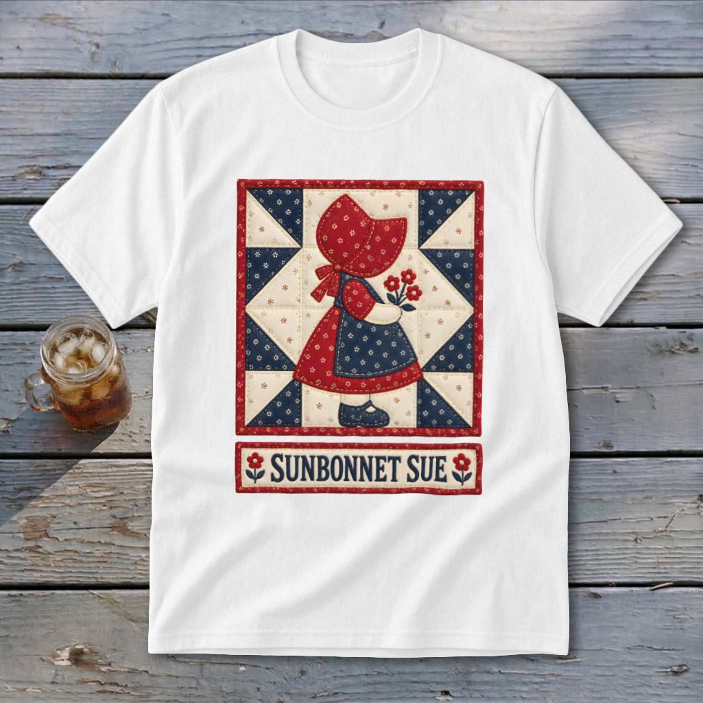 White t-shirt with a quilt-style illustration of Sunbonnet Sue holding flowers.