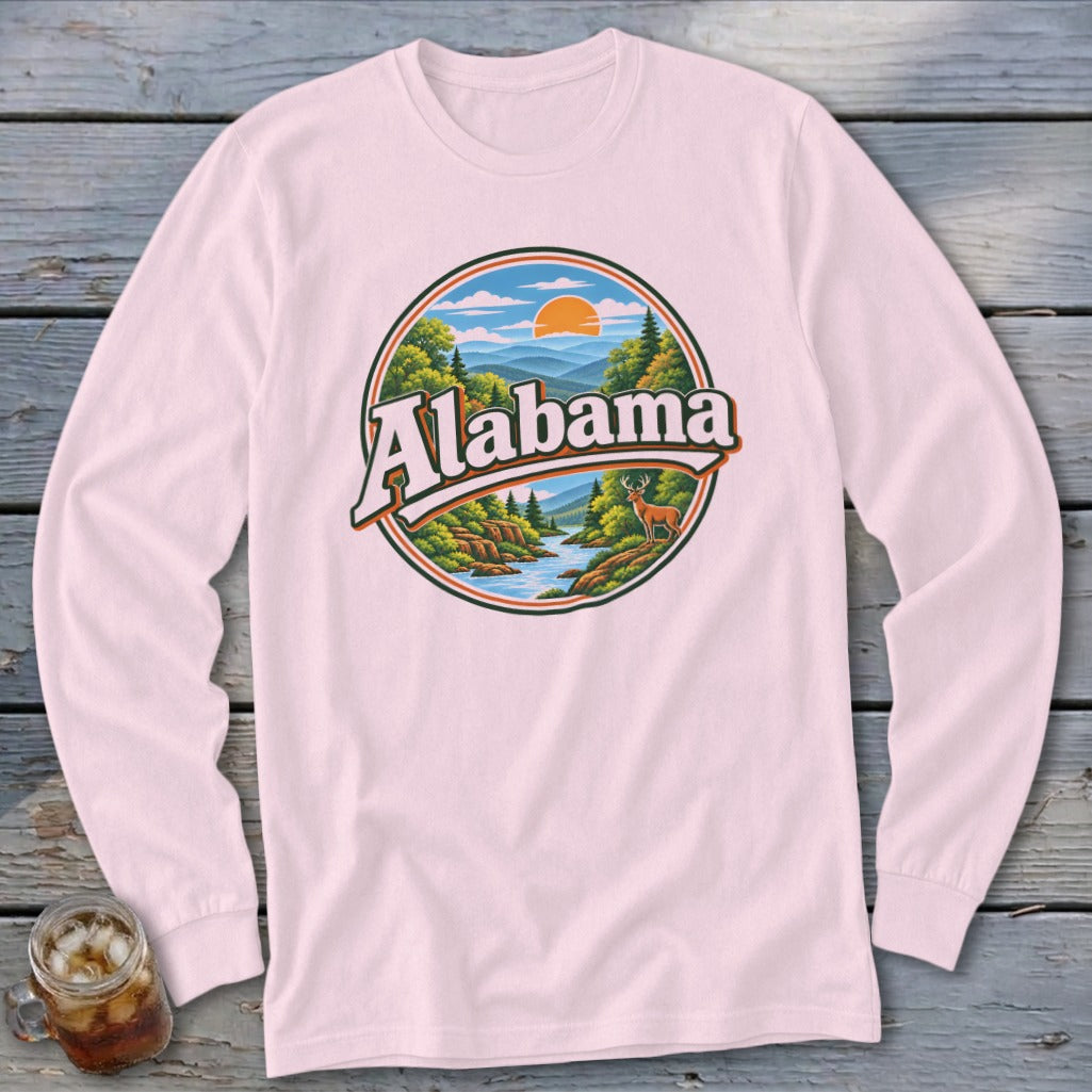 Pink long-sleeve shirt with a circular graphic of a deer by a river and the word "Alabama."