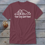Maroon t-shirt with a white graphic of a sleeping basset hound and the text That Dog Won't Hunt.