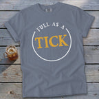 Grey t-shirt with text "FULL AS A TICK" inside a white circle.