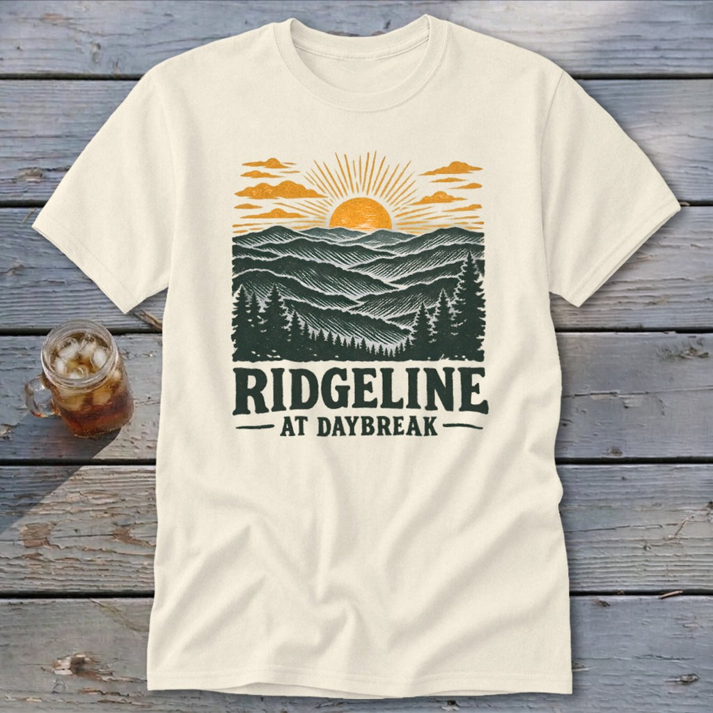 Cream t-shirt with a vintage landscape design and text "RIDGELINE AT DAYBREAK".