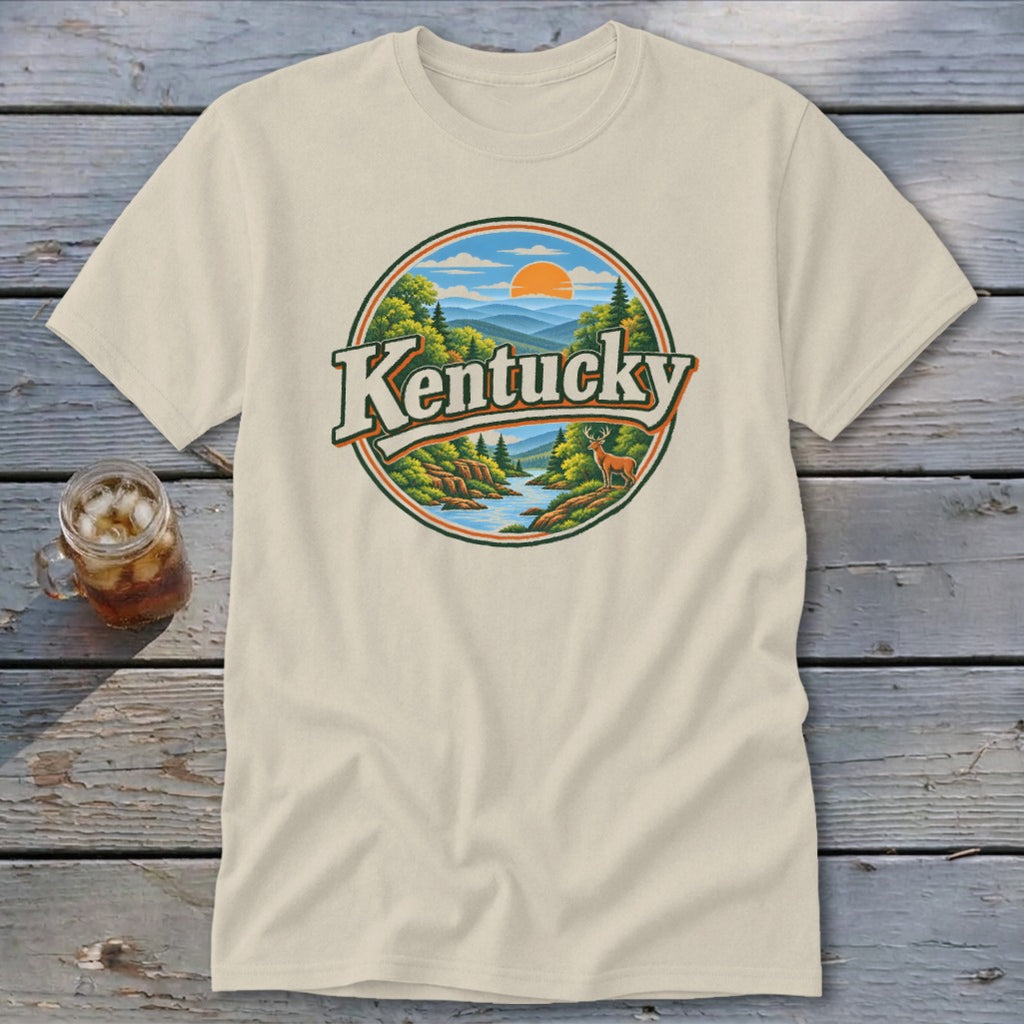Cream t-shirt with circular Kentucky landscape graphic featuring mountains, river, and deer.