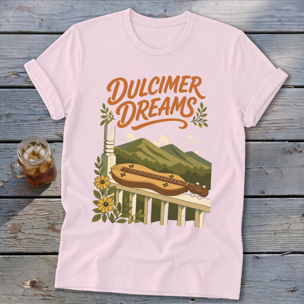 Pink t-shirt with "Dulcimer Dreams" text and a dulcimer on a porch.