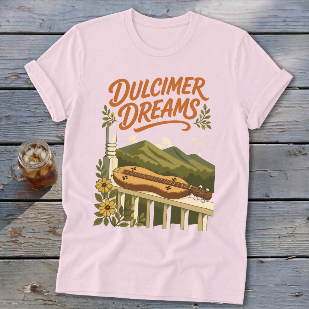 Pink t-shirt with "Dulcimer Dreams" text and a dulcimer on a porch.