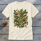 Cream t-shirt with a vintage botanical print of pine branches, holly, and pinecones.
