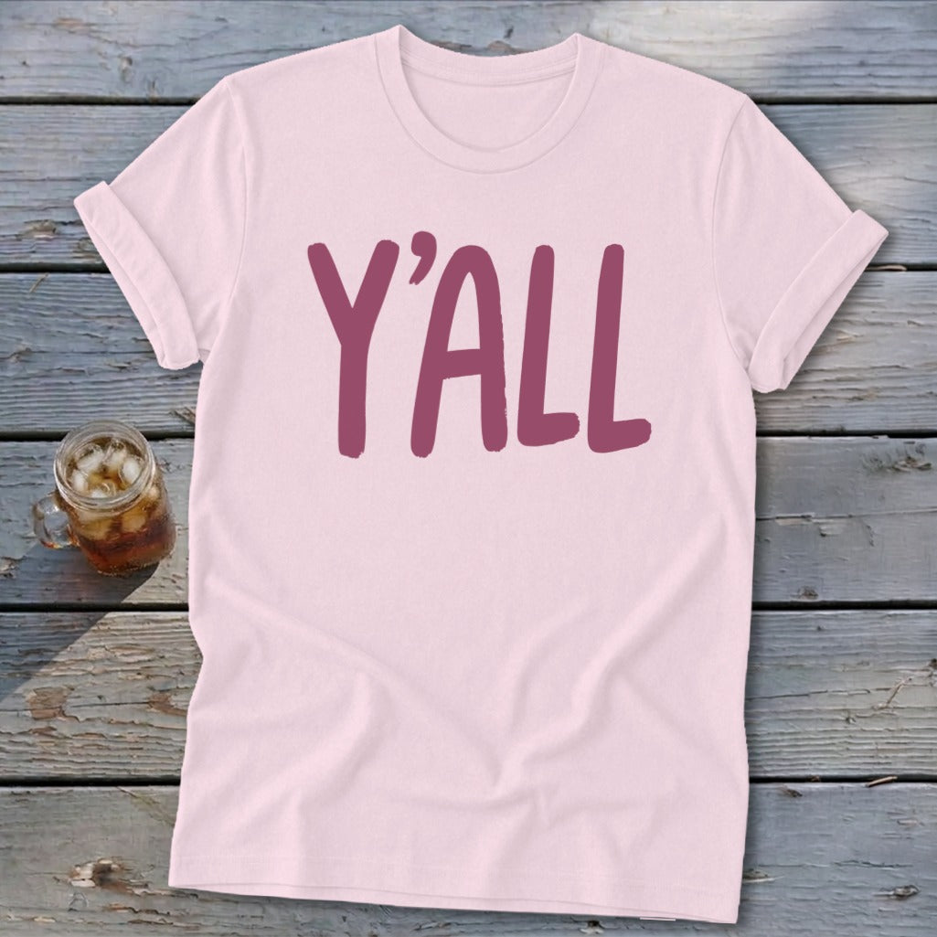 Pink t-shirt with dark pink "Y'all" text and a glass of iced tea.