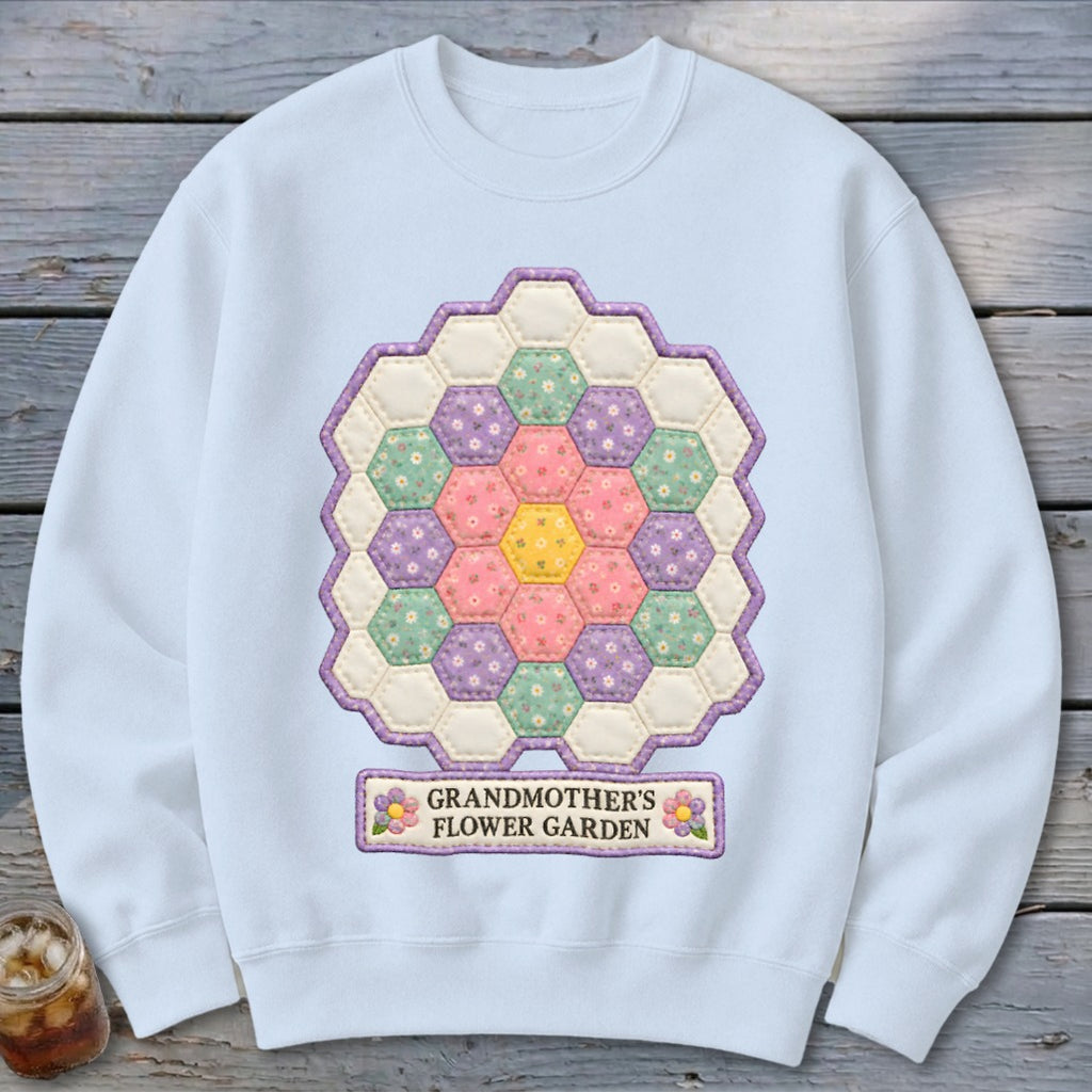 Light blue sweatshirt with hexagon quilt design and "GRANDMOTHER'S FLOWER GARDEN" text.