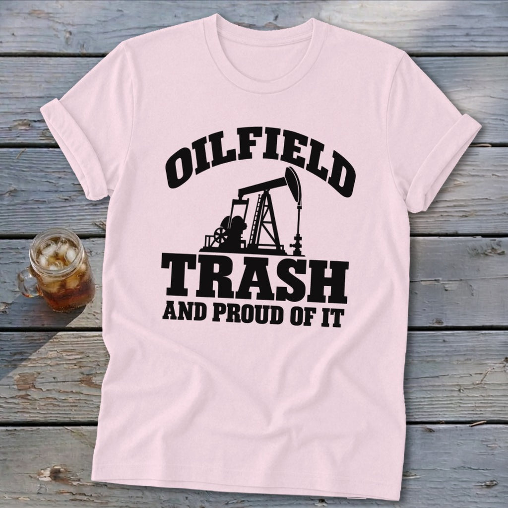 Pink t-shirt with black "Oilfield Trash and Proud of It" text and pumpjack graphic.