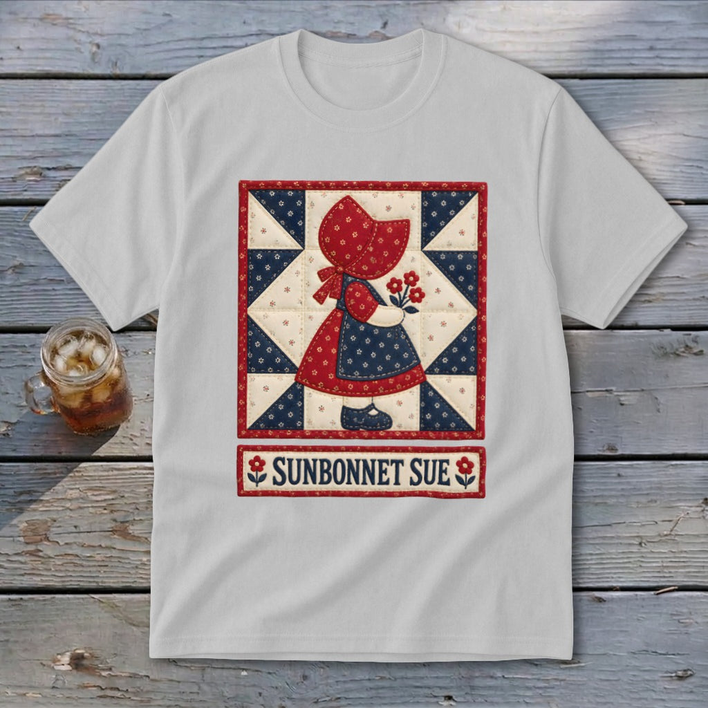 White t-shirt featuring a Sunbonnet Sue quilt block and text below.
