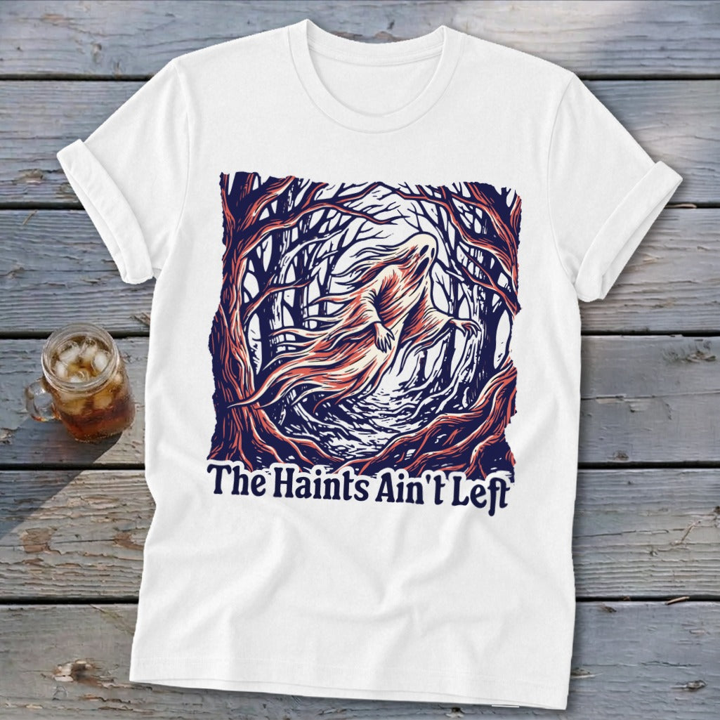 White t-shirt with a ghost in a forest and text "The Haint's Ain't Left".
