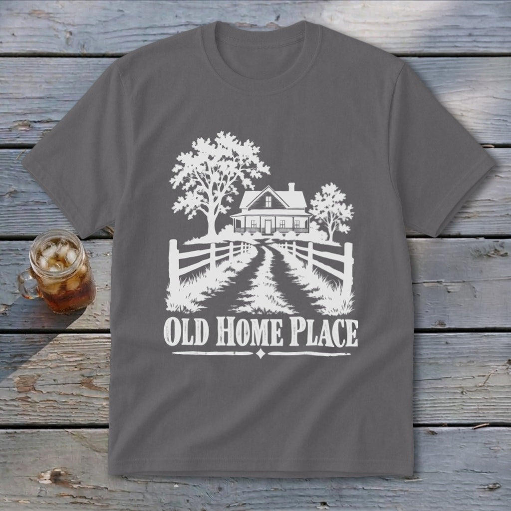 T-shirt with white graphic of a farmhouse, trees, fence, and "OLD HOME PLACE" text.