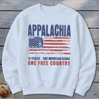 A white crewneck sweatshirt featuring a distressed graphic with the text Appalachia, a weathered American flag, and the slogan 13 states one mountain range one free country.