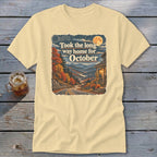 Light yellow t-shirt with graphic "Took the long way home for October".