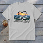 White t-shirt with "Appalachia Strong" text and a heart over a mountain sunset.