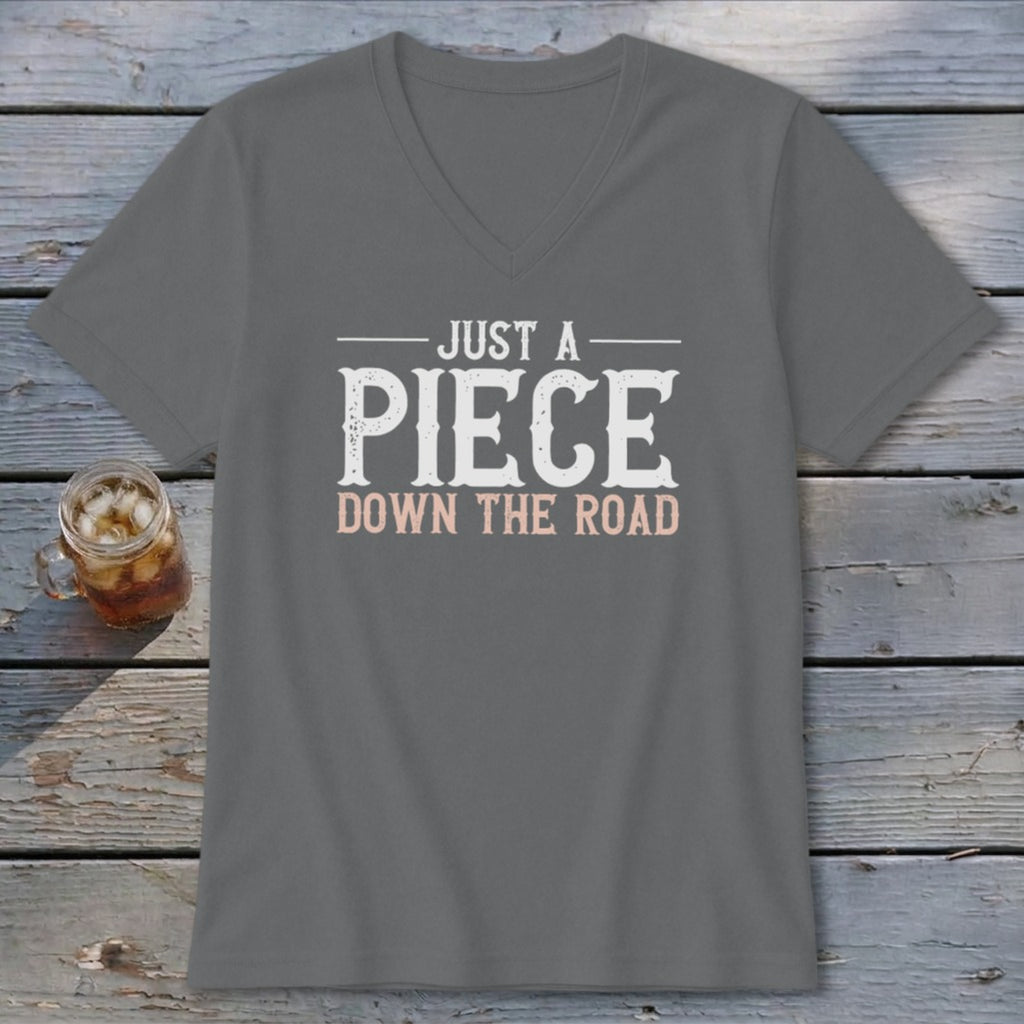 Grey V-neck t-shirt with "JUST A PIECE DOWN THE ROAD" graphic.