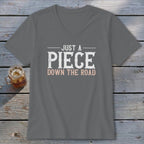 Grey V-neck t-shirt with "JUST A PIECE DOWN THE ROAD" graphic.