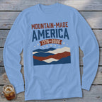 Light blue long-sleeve t-shirt with a red, white, and blue mountain graphic and the text Mountain-Made America 1776-2026.