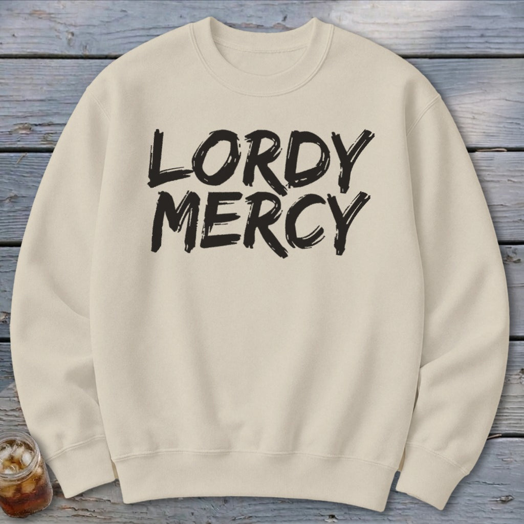 Cream sweatshirt with "LORDY MERCY" in black brushstroke font.