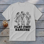 White t-shirt with "FLAT-FOOT DANCING" text and a fiddle player with two dancers.