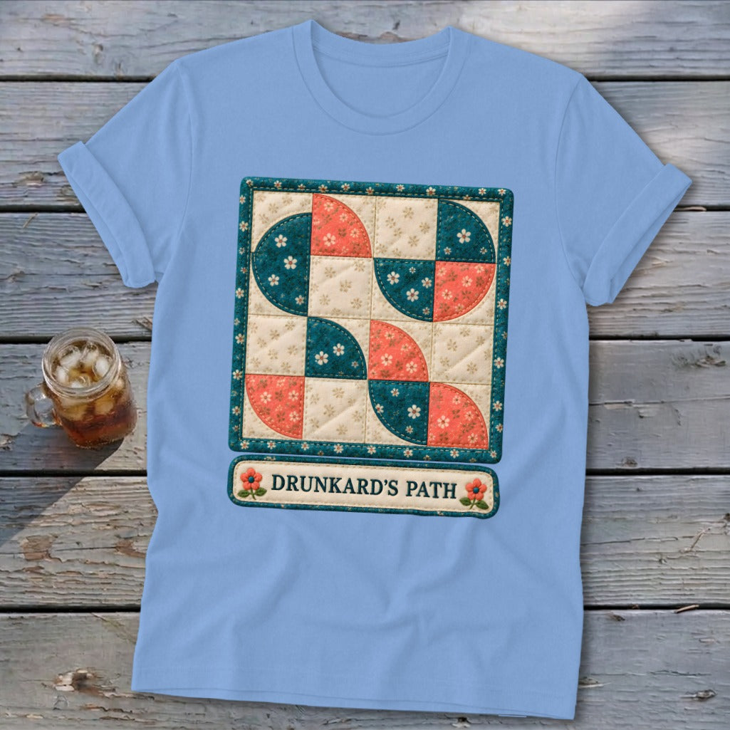Light blue t-shirt featuring a Drunkard's Path quilt block and the text "DRUNKARD'S PATH".